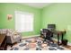 Bright home office features a comfortable chair, built-in shelving, and a workspace at 3 Moss Spring Ct, Durham, NC 27712