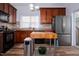 Modern kitchen with wood butcher block island and stainless steel appliances at 3 Moss Spring Ct, Durham, NC 27712