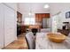 Modern kitchen with wood cabinets, stainless steel appliances, and a marble table at 3 Moss Spring Ct, Durham, NC 27712