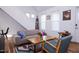 Open living room with hardwood floors, staircase and lots of natural light at 3 Moss Spring Ct, Durham, NC 27712