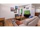 Open living area with hardwood floors, stylish seating, and a coffee table at 3 Moss Spring Ct, Durham, NC 27712