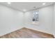 Bright bedroom with hardwood floors and a window offering natural light at 406 Everette Ave, Clayton, NC 27520