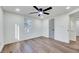 Bright bedroom with hardwood floors, ceiling fan and neutral walls at 406 Everette Ave, Clayton, NC 27520