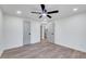 Bright bedroom with ceiling fan, hardwood floors, and access to bathroom at 406 Everette Ave, Clayton, NC 27520