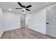 Bright bedroom with ceiling fan and hardwood floors, access to hallway at 406 Everette Ave, Clayton, NC 27520