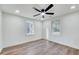 Bedroom with hardwood floors, ceiling fan and neutral walls at 406 Everette Ave, Clayton, NC 27520