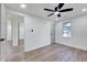 Bedroom with ceiling fan, hardwood floors, and access to another room at 406 Everette Ave, Clayton, NC 27520