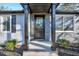 Modern front entrance with stone facade and black door at 406 Everette Ave, Clayton, NC 27520