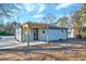 Side view of the house showing gray siding, patio and pergola at 406 Everette Ave, Clayton, NC 27520