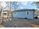 Exterior view of the house, showcasing gray siding and a pergola at 406 Everette Ave, Clayton, NC 27520