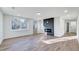 Bright living room with hardwood floors and fireplace at 406 Everette Ave, Clayton, NC 27520