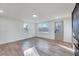 Living room with hardwood floors, fireplace, and access to backyard at 406 Everette Ave, Clayton, NC 27520