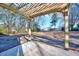 Relaxing patio area with pergola, offering a shaded outdoor space at 406 Everette Ave, Clayton, NC 27520