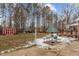 Yard with shed, picnic table, and snowy ground at 4139 Somerset Dr, Oxford, NC 27565
