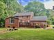 Expansive backyard with a large deck, perfect for outdoor dining and recreation at 4139 Somerset Dr, Oxford, NC 27565