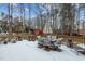 Deck with table and chairs provides relaxing space in wooded setting at 4139 Somerset Dr, Oxford, NC 27565