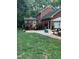 Charming backyard with mature trees, patio area, and well-maintained lawn at 4139 Somerset Dr, Oxford, NC 27565