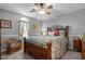 Comfortable bedroom with a decorative window, plush bedding, and warm, inviting decor at 4139 Somerset Dr, Oxford, NC 27565