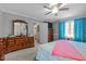 Bedroom with large dresser, ceiling fan, and queen bed at 4139 Somerset Dr, Oxford, NC 27565