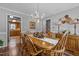 Dining room with hardwood floors, a large wooden table, and chandelier at 4139 Somerset Dr, Oxford, NC 27565