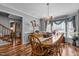 Bright dining room with hardwood floors, a wooden table, and chandelier at 4139 Somerset Dr, Oxford, NC 27565