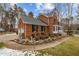 Attractive two-story brick home with lush landscaping and a well-manicured front yard at 4139 Somerset Dr, Oxford, NC 27565