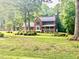 Beautiful brick home with a well-manicured lawn and mature landscaping at 4139 Somerset Dr, Oxford, NC 27565