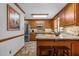 Kitchen boasts granite countertops and wood cabinets at 4139 Somerset Dr, Oxford, NC 27565