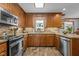 Charming kitchen boasting granite counters, backsplash and wooden cabinetry at 4139 Somerset Dr, Oxford, NC 27565