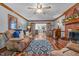 Living room features hardwood floors, fireplace, and French doors at 4139 Somerset Dr, Oxford, NC 27565