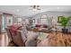 Spacious living room with hardwood floors, comfy furniture, and a ceiling fan at 4139 Somerset Dr, Oxford, NC 27565