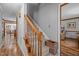 Staircase with wood railing leading to upper level at 4139 Somerset Dr, Oxford, NC 27565