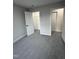 Neutrally painted bedroom has a closet and doorway to another room. Perfect for an office! at 504 Tucker St, Four Oaks, NC 27524