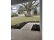 Inviting front yard featuring a large tree and a walkway leading to the home at 504 Tucker St, Four Oaks, NC 27524