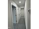 Hallway with multiple doors and neutral color scheme and carpet flooring, enhancing the home's interior flow at 504 Tucker St, Four Oaks, NC 27524