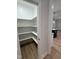 Walk-in pantry with ample shelving and hardwood floors at 504 Tucker St, Four Oaks, NC 27524