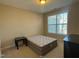 Well-lit bedroom featuring a queen-size bed and window at 549 Balsam Fir Dr Dr, Cary, NC 27519