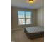 Comfortable bedroom with large window and carpeted floor at 549 Balsam Fir Dr Dr, Cary, NC 27519