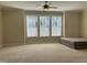 Spacious bedroom with a ceiling fan and large windows at 549 Balsam Fir Dr Dr, Cary, NC 27519