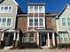 Brick front exterior of charming townhome with multiple windows and landscaping at 549 Balsam Fir Dr Dr, Cary, NC 27519