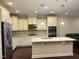 Modern kitchen with granite island and stainless steel appliances at 549 Balsam Fir Dr Dr, Cary, NC 27519