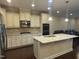 Eat-in kitchen with granite island and stainless steel appliances at 549 Balsam Fir Dr Dr, Cary, NC 27519