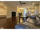 Living room with hardwood floors, fireplace, and leather couch at 549 Balsam Fir Dr Dr, Cary, NC 27519