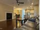 Open living room with hardwood floors, fireplace, and kitchen access at 549 Balsam Fir Dr Dr, Cary, NC 27519
