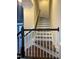 Staircase with dark wood steps and white railing at 549 Balsam Fir Dr Dr, Cary, NC 27519