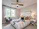 Bedroom with comfy bed, chair, and large window at 64 W Beech Slope Ct, Chapel Hill, NC 27517
