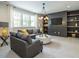 Spacious bonus room features a built-in media center and comfortable seating at 64 W Beech Slope Ct, Chapel Hill, NC 27517