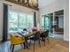 Bright dining room with hardwood floors and sliding glass doors to a deck at 64 W Beech Slope Ct, Chapel Hill, NC 27517