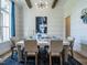 Dining room with shiplap walls, a large window, and a modern chandelier at 64 W Beech Slope Ct, Chapel Hill, NC 27517