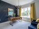 Home office with a large window, built-in desk, and stylish decor at 64 W Beech Slope Ct, Chapel Hill, NC 27517